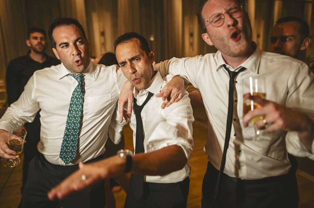 A group of men are having a good time at a party.