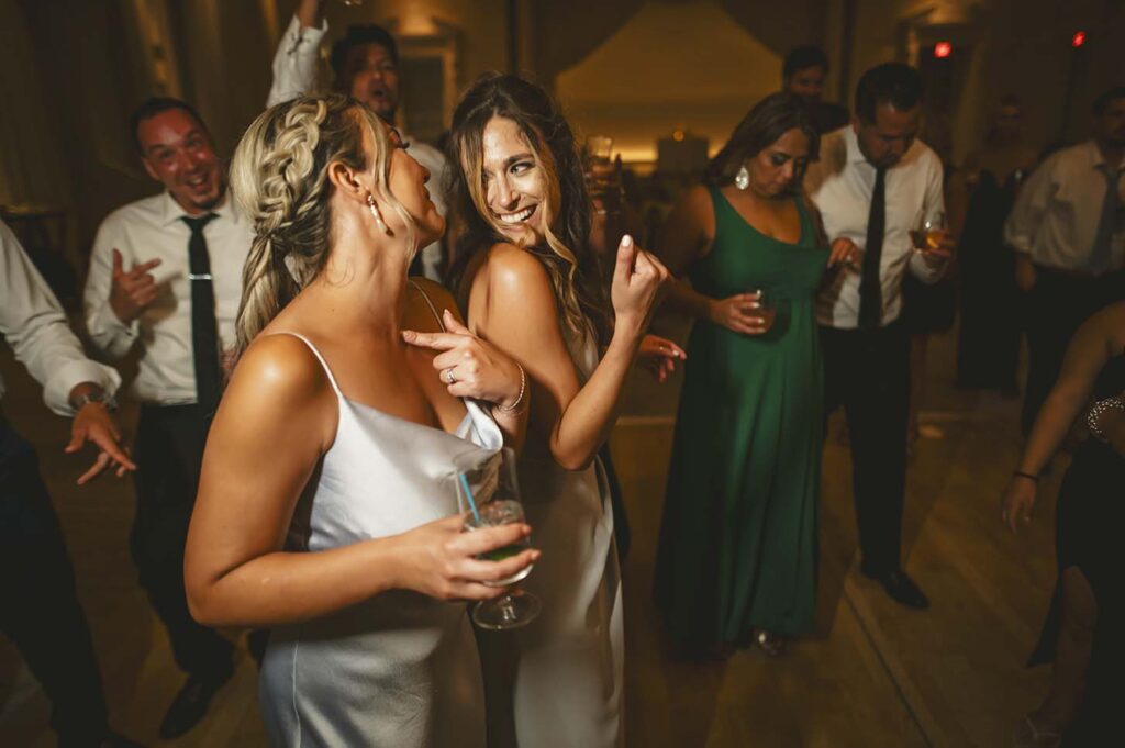Bridesmaids dancing on the dance floor at a wedding reception.